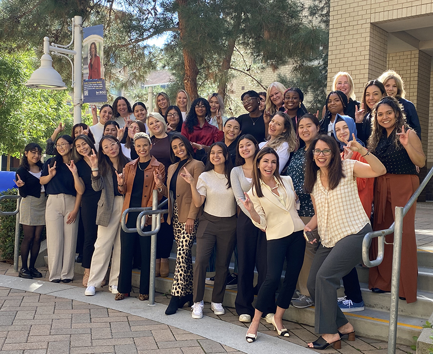 LeadHER members flash their Anteater zot of support.