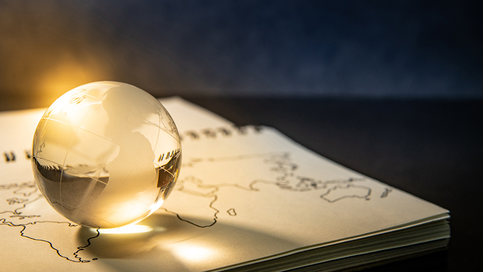 Globe on top of a book